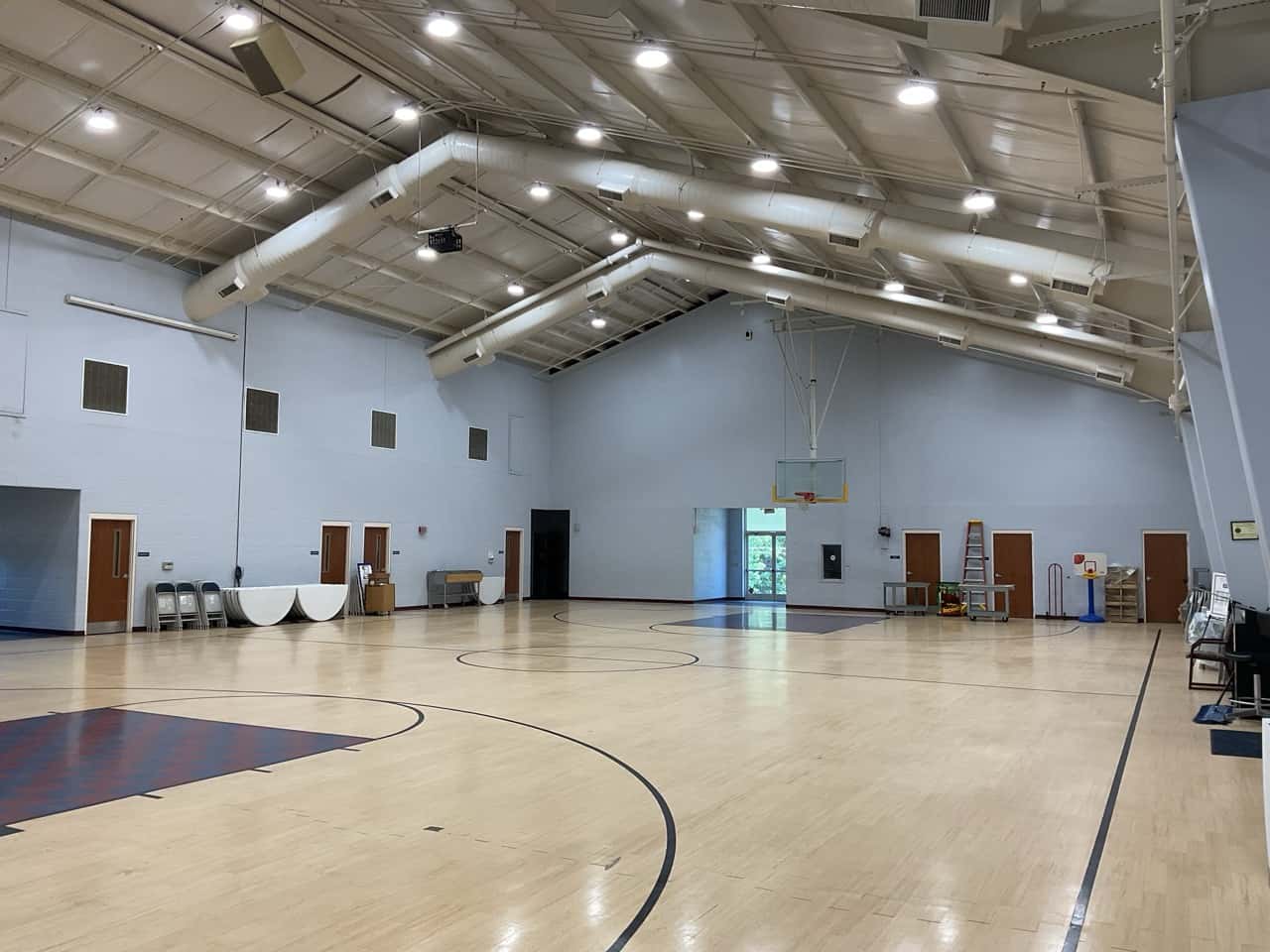 Large recreation facility gymnasium with bright LED high-bay lighting installed by DTL Energy Solutions