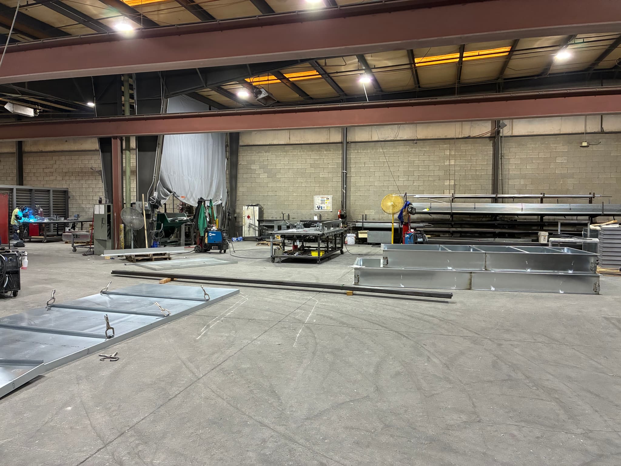 LED high-bay fixtures mounted in industrial facility ceiling