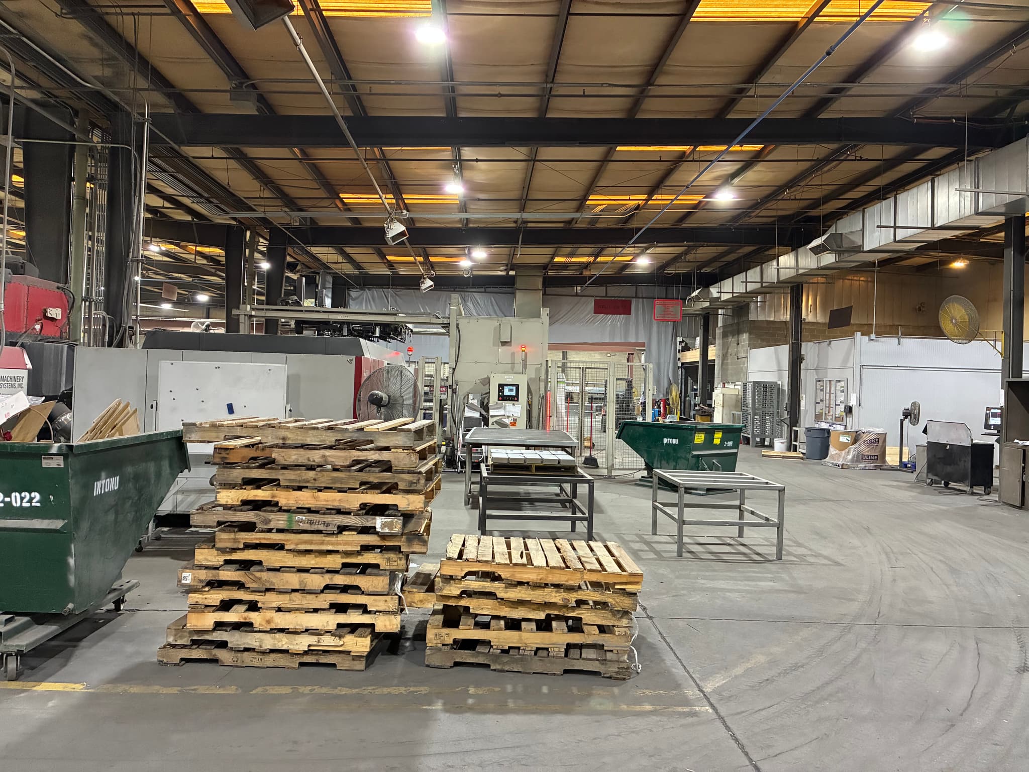 Same industrial warehouse with bright white LED high-bays